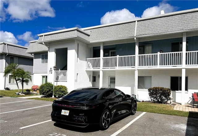 view of property with uncovered parking