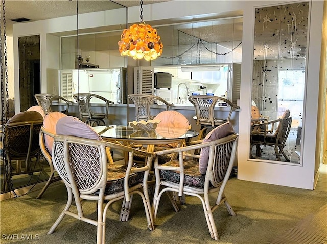 dining space featuring carpet