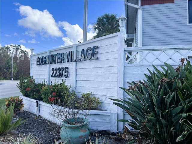community / neighborhood sign with a garage
