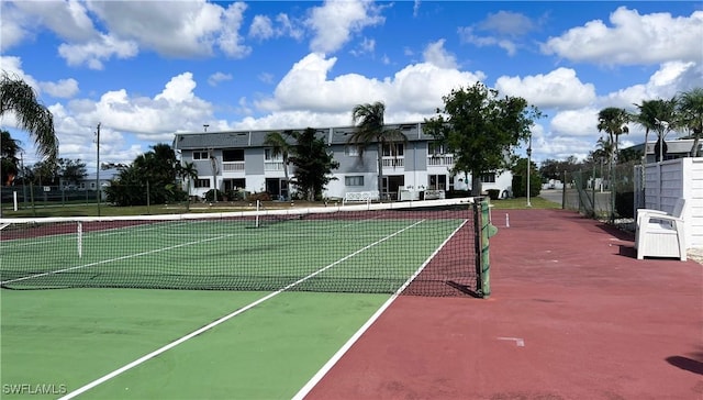 view of tennis court with fence
