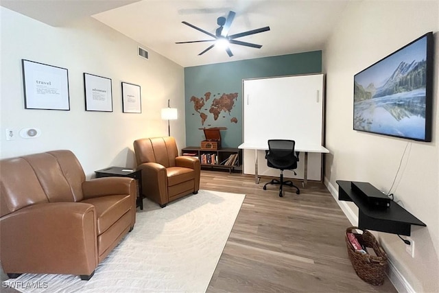office with a ceiling fan, wood finished floors, and baseboards