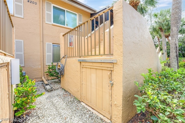 4200 Looking Glass Ln Unit 4206, Naples, FL 34112 - view of side of property featuring stucco siding