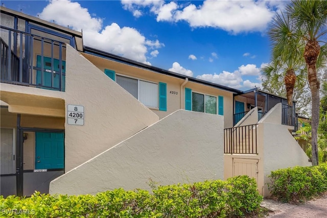 4200 Looking Glass Ln Unit 4206, Naples, FL 34112 - view of front of property with stucco siding