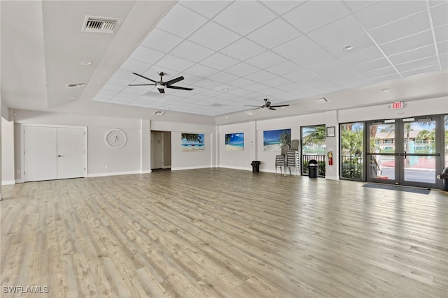 4200 Looking Glass Ln Unit 4206, Naples, FL 34112 - unfurnished living room featuring a paneled ceiling, a ceiling fan, light wood-type flooring, and baseboards