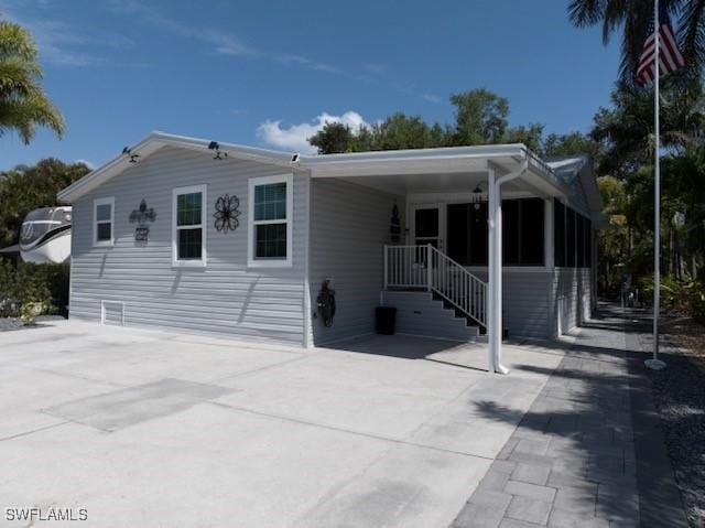 5570 Cypresswoods Resort Dr, Fort Myers, FL 33905 - view of front of property with driveway and a carport