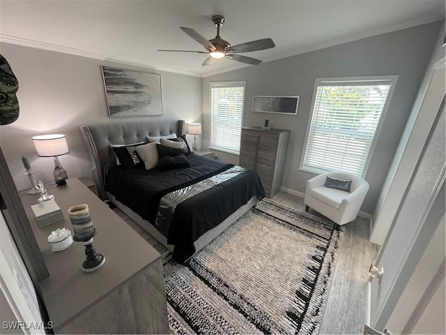 5570 Cypresswoods Resort Dr, Fort Myers, FL 33905 - bedroom with wood finished floors, crown molding, baseboards, vaulted ceiling, and ceiling fan