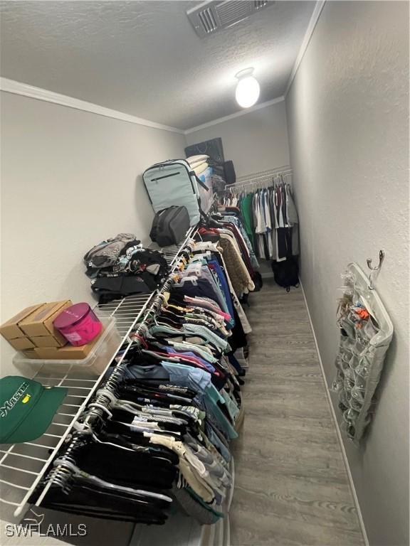 5570 Cypresswoods Resort Dr, Fort Myers, FL 33905 - spacious closet with wood finished floors