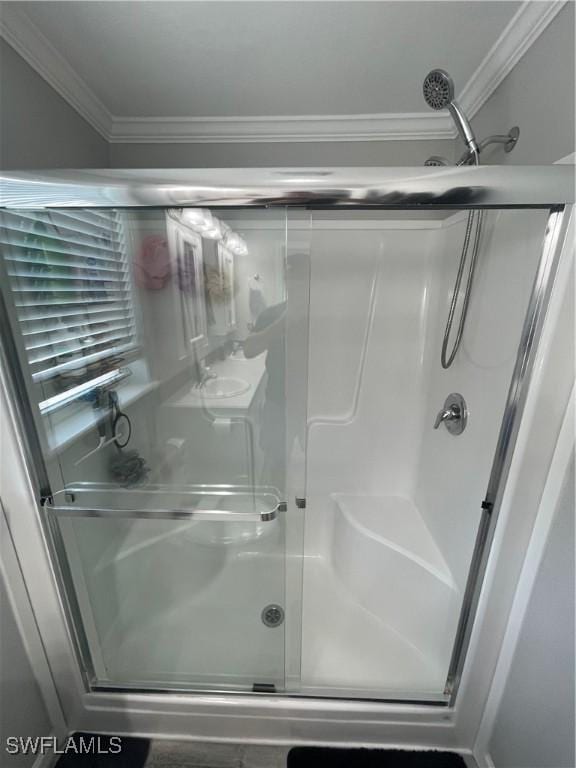 5570 Cypresswoods Resort Dr, Fort Myers, FL 33905 - bathroom with a stall shower and crown molding