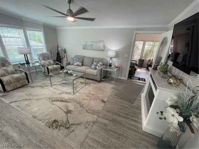 5570 Cypresswoods Resort Dr, Fort Myers, FL 33905 - living area featuring crown molding, wood finished floors, healthy amount of natural light, a ceiling fan, and baseboards
