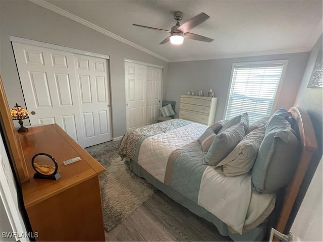 5570 Cypresswoods Resort Dr, Fort Myers, FL 33905 - bedroom featuring two closets, crown molding, wood finished floors, vaulted ceiling, and ceiling fan