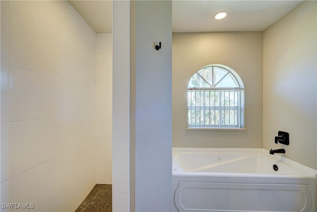 bathroom featuring a garden tub