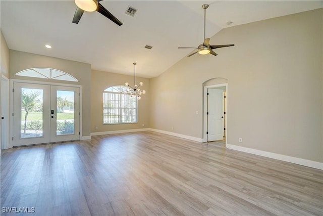 unfurnished living room featuring a ceiling fan, light wood-style floors, a chandelier, baseboards, and recessed lighting