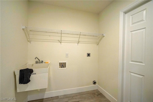 laundry room with wood finished floors, baseboards, hookup for an electric dryer, and washer hookup