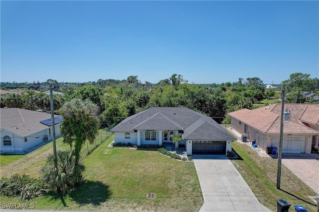 view of front of house with concrete driveway and a garage
