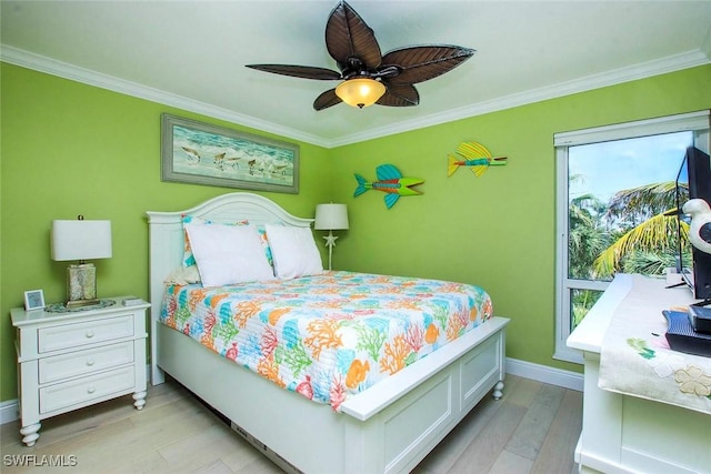 bedroom with light wood-style floors, multiple windows, crown molding, baseboards, and a ceiling fan