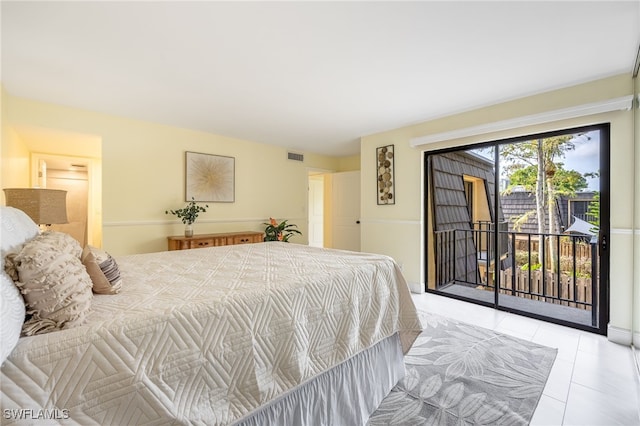 bedroom with access to exterior and light tile patterned floors