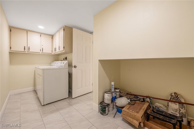 laundry room with cabinet space, washing machine and dryer, baseboards, and recessed lighting