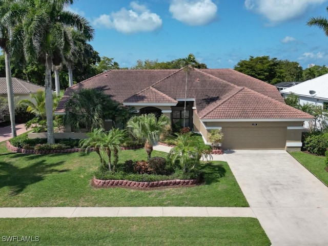 mediterranean / spanish-style house with a tiled roof, a garage, stucco siding, a front yard, and driveway