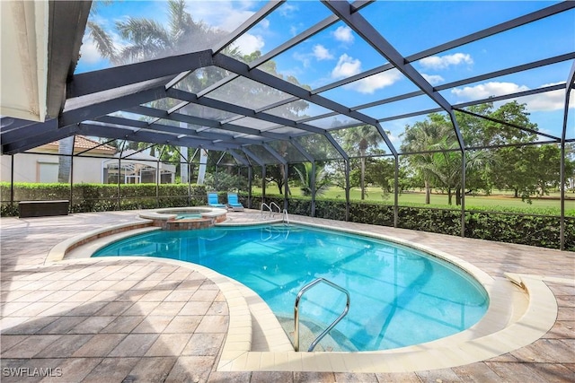 view of swimming pool featuring a pool with connected hot tub, a patio, and a lanai