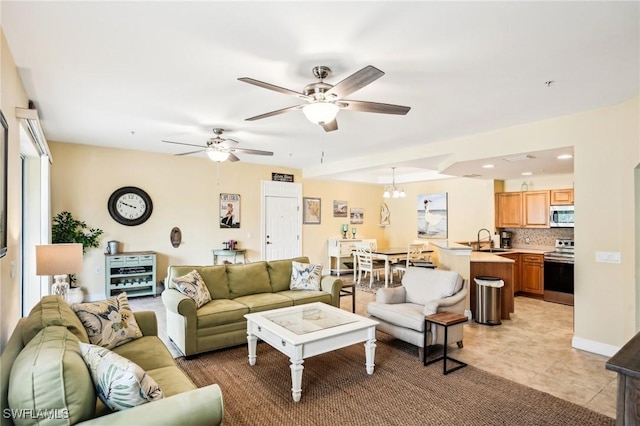 1520 SW 50th St Unit 202, Cape Coral, FL 33914 - living room with ceiling fan, a chandelier, healthy amount of natural light, and light tile patterned floors