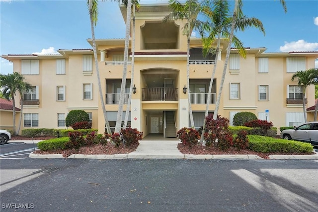 1520 SW 50th St Unit 202, Cape Coral, FL 33914 - view of property with uncovered parking