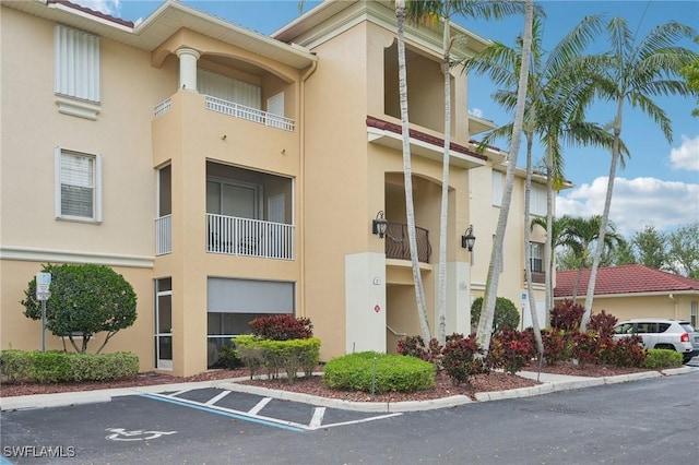 1520 SW 50th St Unit 202, Cape Coral, FL 33914 - view of property featuring uncovered parking