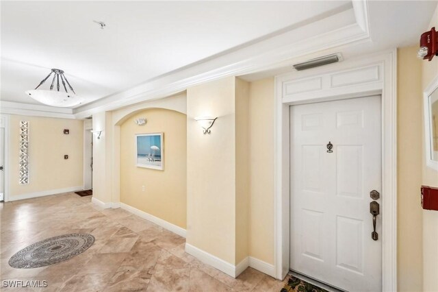 1520 SW 50th St Unit 202, Cape Coral, FL 33914 - entrance foyer featuring a tray ceiling and baseboards