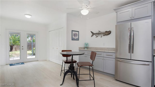767 Glendale Ave, Naples, FL 34110 - kitchen featuring freestanding refrigerator, gray cabinets, light wood-type flooring, and ceiling fan