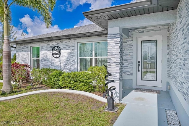 doorway to property featuring stone siding