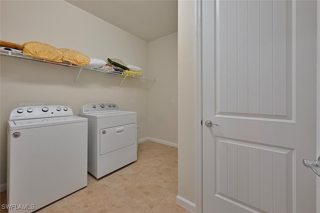 20956 Corkscrew Shores Blvd E, Estero, FL 33928 - laundry room with separate washer and dryer, baseboards, and light tile patterned floors