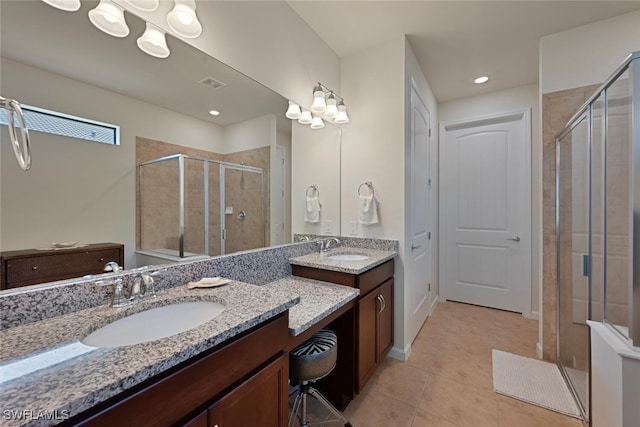 20956 Corkscrew Shores Blvd E, Estero, FL 33928 - bathroom featuring a shower stall, tile patterned floors, and two vanities