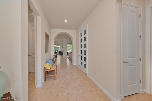 20956 Corkscrew Shores Blvd E, Estero, FL 33928 - corridor featuring arched walkways, light tile patterned floors, recessed lighting, and baseboards