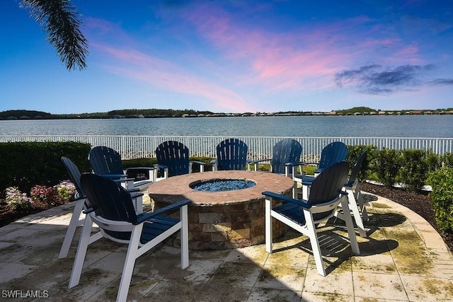 20956 Corkscrew Shores Blvd E, Estero, FL 33928 - view of patio / terrace featuring an outdoor fire pit, fence, and a water view