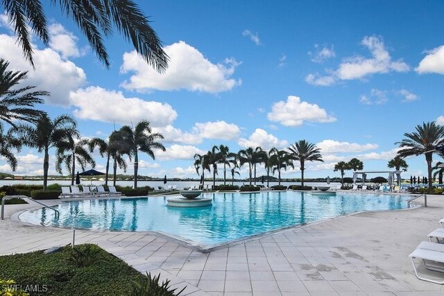 20956 Corkscrew Shores Blvd E, Estero, FL 33928 - community pool featuring a patio area