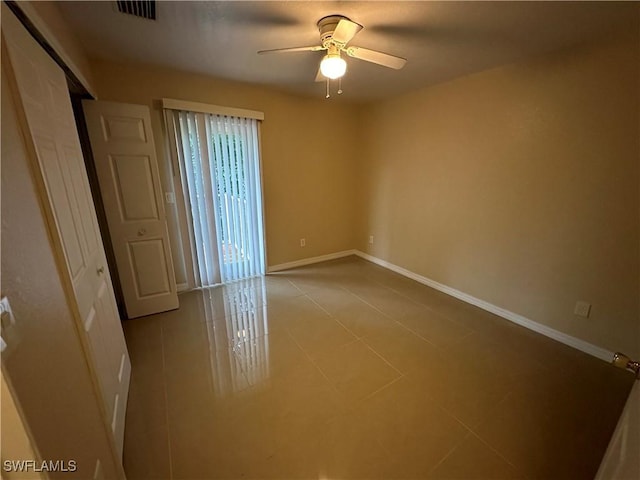 5550 Birdsong Ln, Bokeelia, FL 33922 - empty room featuring baseboards, ceiling fan, and tile patterned flooring