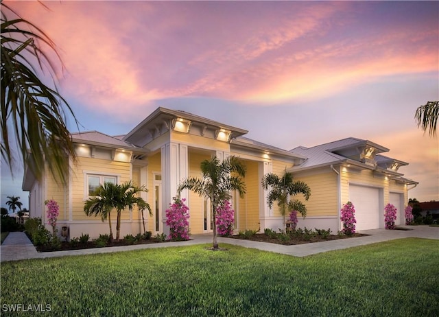 14931 David Dr, Fort Myers, FL 33908 - view of front of property with a front yard, a garage, and concrete driveway