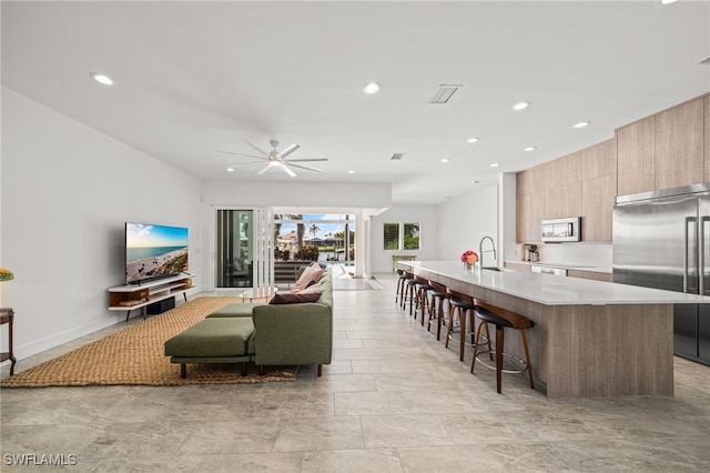 14931 David Dr, Fort Myers, FL 33908 - living room featuring recessed lighting, a ceiling fan, and baseboards