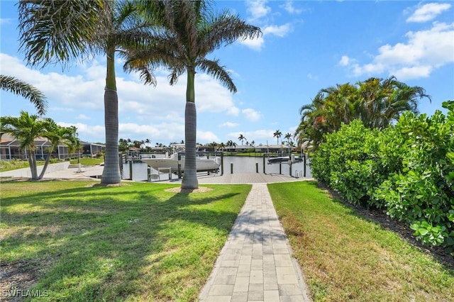 14931 David Dr, Fort Myers, FL 33908 - view of property's community featuring a lawn, boat lift, a dock, and a water view