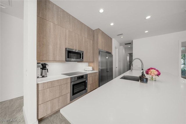 14931 David Dr, Fort Myers, FL 33908 - kitchen with stainless steel appliances, modern cabinets, a sink, light countertops, and recessed lighting