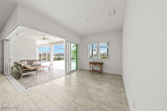14931 David Dr, Fort Myers, FL 33908 - living area featuring a ceiling fan, baseboards, and light tile patterned flooring