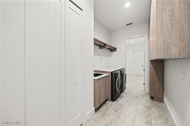 14931 David Dr, Fort Myers, FL 33908 - clothes washing area with independent washer and dryer, recessed lighting, baseboards, and light marble finish floors