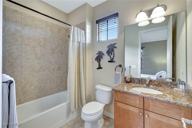 bathroom with shower / tub combo with curtain, vanity, toilet, baseboards, and tile patterned flooring