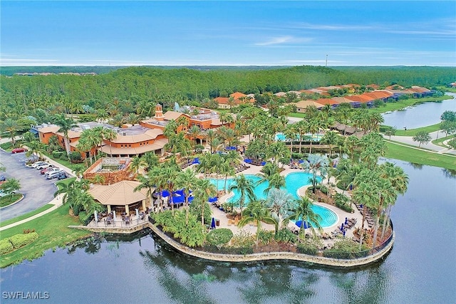 11976 Nalda St Unit 9301, Fort Myers, FL 33912 - bird's eye view of a pool, a large body of water, and a heavily wooded area