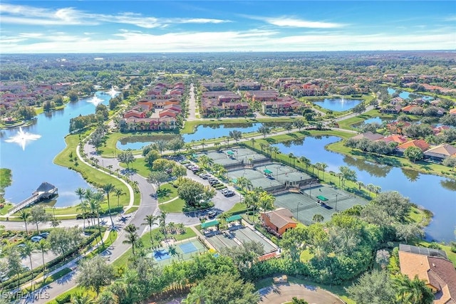aerial overview of property's location with a large body of water and nearby suburban area