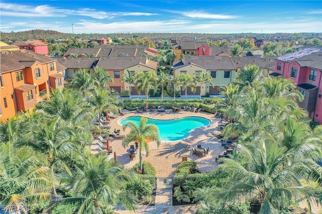 aerial view of property's location with nearby suburban area and a pool area
