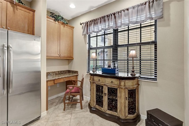 office area with built in study area, baseboards, light tile patterned floors, and recessed lighting