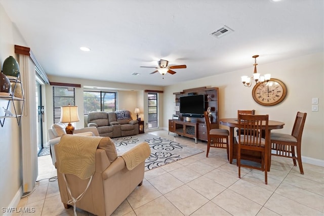 living room featuring light tile patterned flooring, a chandelier, a ceiling fan, baseboards, and recessed lighting