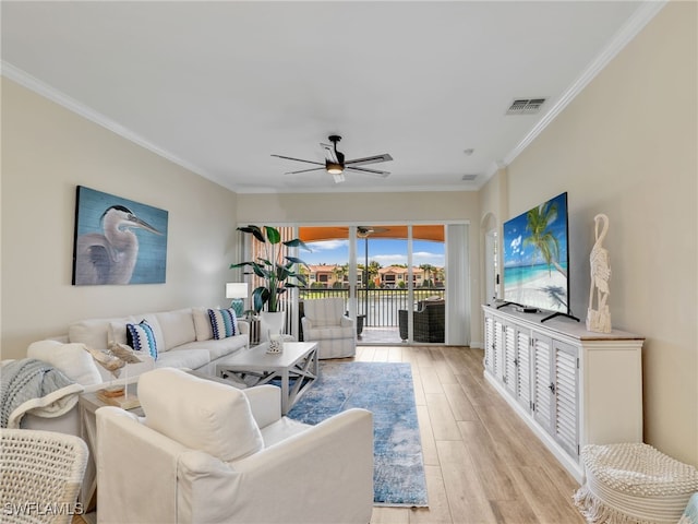 8532 Via Lungomare Cir Unit 203, Estero, FL 33928 - living room featuring crown molding, ceiling fan, and light wood-style floors