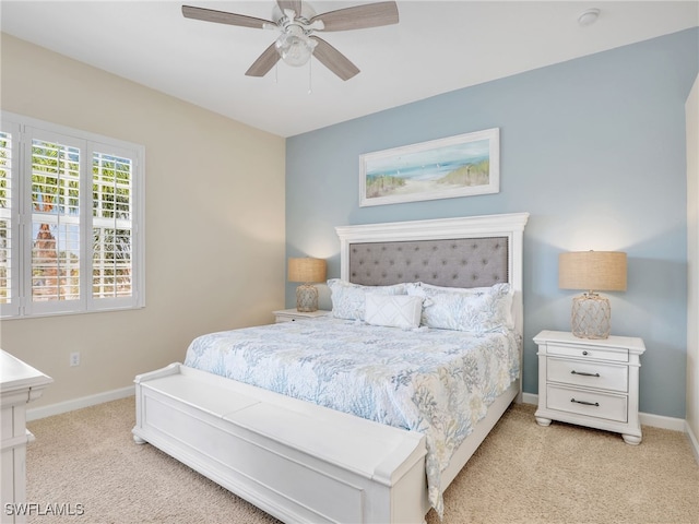 8532 Via Lungomare Cir Unit 203, Estero, FL 33928 - bedroom with light carpet, baseboards, and ceiling fan