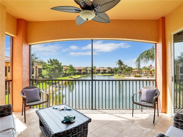 8532 Via Lungomare Cir Unit 203, Estero, FL 33928 - sunroom / solarium with a water view, ceiling fan, and a residential view
